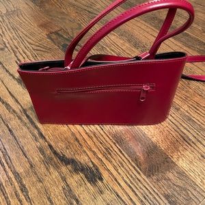 Asymmetrical red leather purse